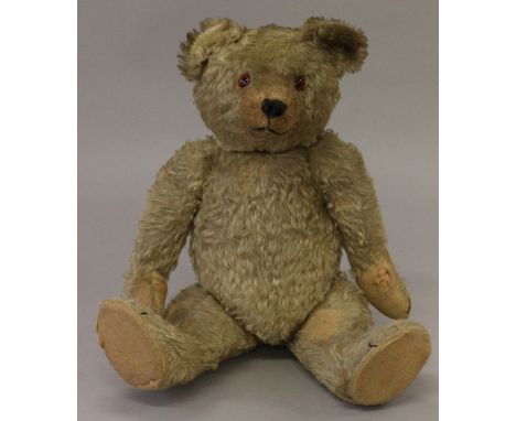 Chiltern teddy bear, straw-filled mohair with worn felt pads, stitched nose, mouth and claws, inoperative growler, ear partly