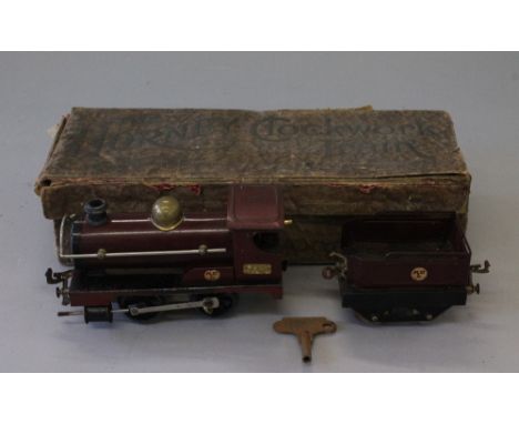 Hornby O Gauge No.1 0-4-0 clock work tender engine. No. 2710 MR style maroon. Early 1920's nut & bolt construction. Front buf