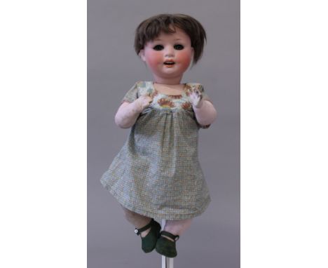 Late 19th/early 20th century Heubach Koppelsdorf (Germany) bisque head doll, mold '300.4', having blue eyes, open mouth with 
