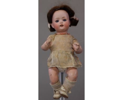 Otto Reinecke (Germany) bisque head composition body doll, impressed 'PM23', having brown hair, blue eyes, open mouth with tw