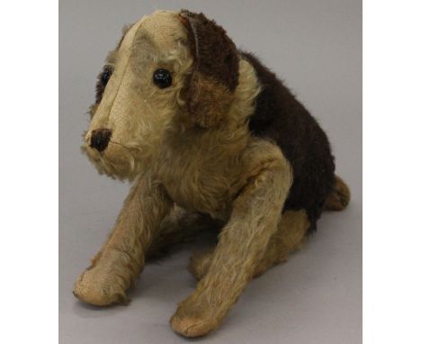 Merrythought 1930's straw-filled dog soft toy with wire frame, stitched nose, collar, label to underbelly. Length 50cm, heigh