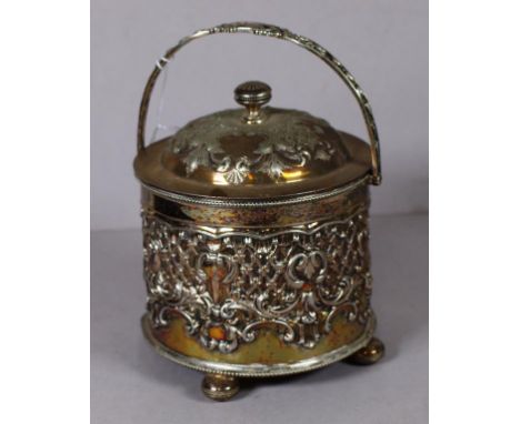 Vintage silver plate biscuit barrel embossed decoration, quad footed. Height 22cm approx (handle extended).