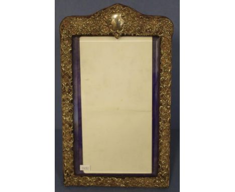 Vintage silver photo frame embossed decoration. (AVs inspected: some lifting of silver to corners). 36cm X 21cm approx (outer