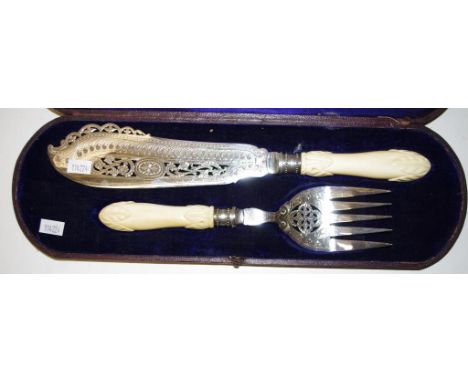 Boxed antique pair silver plate fish servers including fish server and fork, carved ivory handles. Export of this item would 