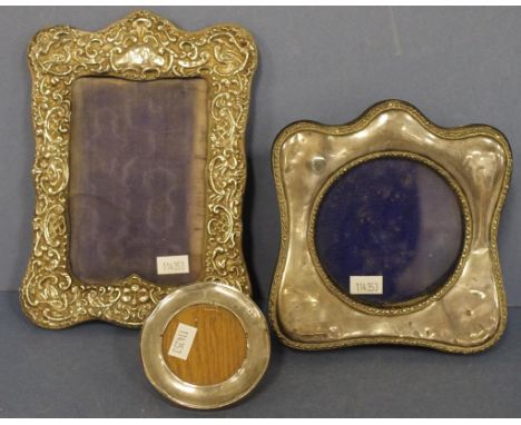 Three various vintage silver photo frames including hallmarked Chester, circa 1905; hallmarked London 1916; and 1 with emboss