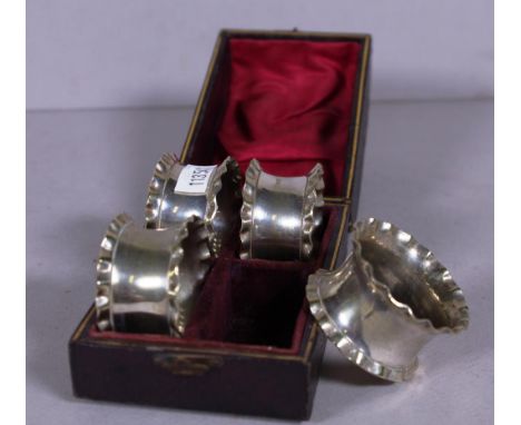 Cased set four vintage silver plated napkin rings Circa 1900.