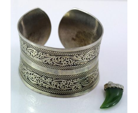 Silver ornate cuff bangle Chinese hallmark, Weight: 46.90 grams together with jade and silver claw shaped pendant