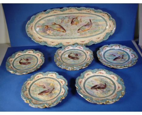 Vintage thirteen piece "Empire" fish set including 11 plates, 1 sauce jug and a serving platter. All fish decorated. Pieces a