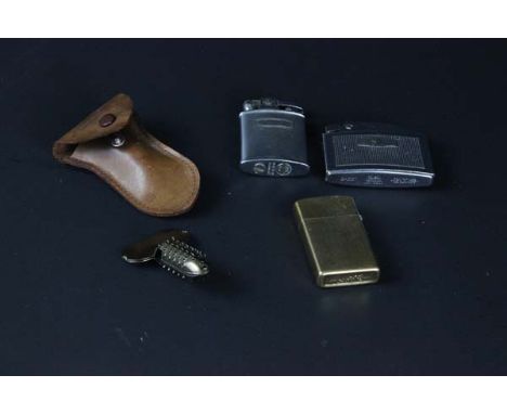 Three lighters including yellow metal Zippo; white metal Ronson Cadet; another Ronson lighter and a 'Terry's Hedgehog' pipe r