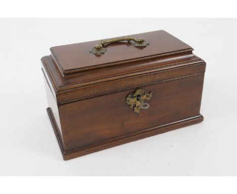 George III mahogany tea caddy, sarcophagus form with brass handle and escutcheon, opening to reveal three open compartments, 