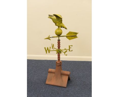 Painted metal and terracotta weather vane, probably of American origin, surmounted with an eagle and ball over a terracotta r
