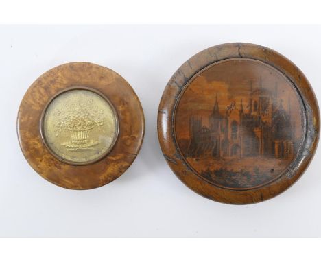 Burr wood circular snuff box, inset with a gilt floral basket disc and lined with tortoiseshell, 7cm diameter, also a further