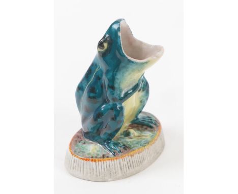 Unusual frog form match holder and striker, glazed colours on a bisque base, height 8cm 