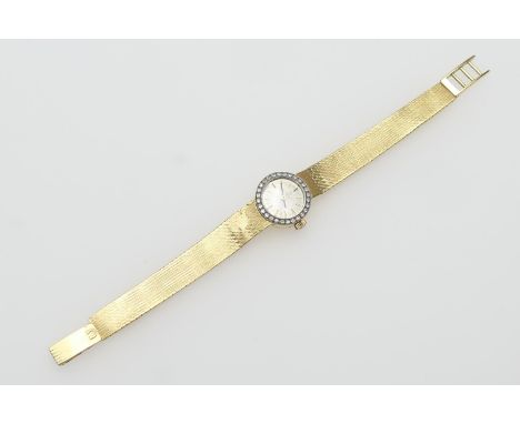 Omega lady's 18ct gold and diamond cocktail watch, the circular champagne coloured dial with baton numerals, the bezel set wi
