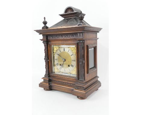 German walnut bracket mantel clock, circa 1900, architectural style case with turned finials, over a brass 15cm dial with sil