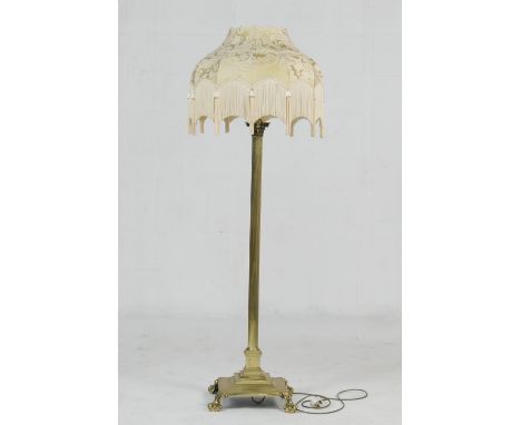 Brass corinthian column extendable standard lamp, have a gold damask and tasselled silk umbrella shade over a reeded column a