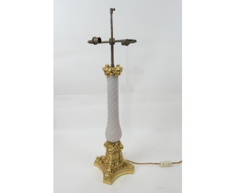 French ormolu and grey glass table lamp, having two light sockets over an ormolu capped wrythen glass moulded baluster column