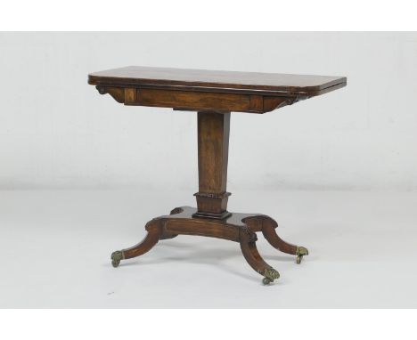 Regency rosewood and brass inlaid folding pedestal card table, circa 1810-20, the swivelling folding top with brass line inla