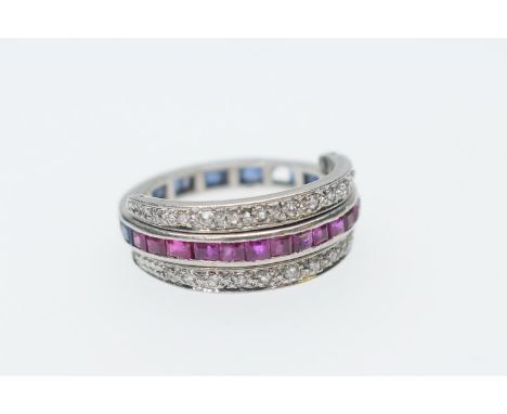 Ruby, sapphire and diamond multi-way ring, having a central band, half set with channel set square cut rubies and half with s