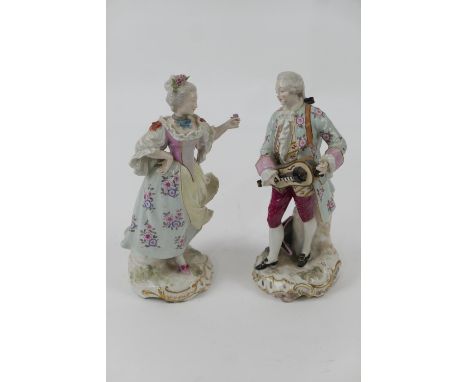 Pair of Sitzendorf porcelain figures of aristocratic courtiers, decorated in colours heightened with gilt, height 22.5cm 