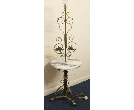 Brass and marble standard/wine table lamp, raised on triform supports on paw feet, height 144cm, table 46cm diameter 