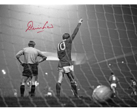 Autographed DENIS LAW 16 x 12 Photo : Manchester United centre-forward DENIS LAW celebrates after scoring one of his four goa