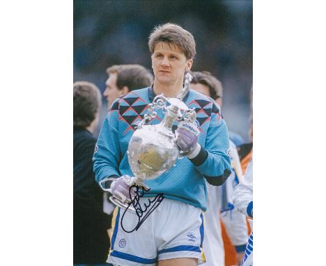Autographed JOHN LUKIC 12 x 8 photo : Col, depicting Leeds United goalkeeper JOHN LUKIC holding the First Division trophy dur