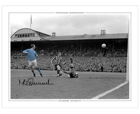 Autographed MIKE SUMMERBEE 16 x 12 Edition : MIKE SUMMERBEE dinks the ball over Newcastle United goalkeeper Ian McFaul to ope