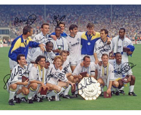 Autographed LEEDS UNITED 16 x 12 Photo : Leeds United players celebrating with the Charity Shield in front of photographers f