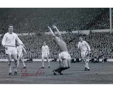 Autographed DENIS LAW 12 x 8 Photo : B/W, depicting a superb image showing Manchester United centre-forward DENIS LAW throwin