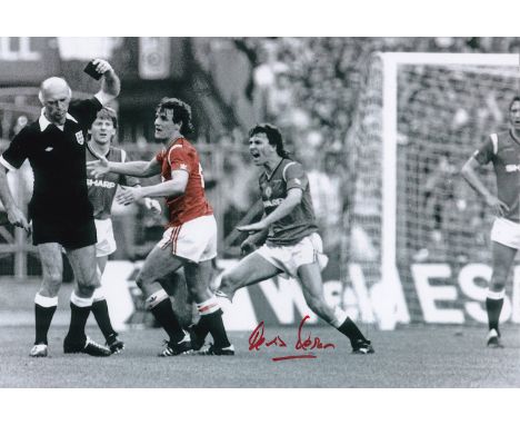 Autographed KEVIN MORAN 12 x 8 photo : Colorized, depicting Manchester United`s KEVIN MORAN getting his marching orders from 