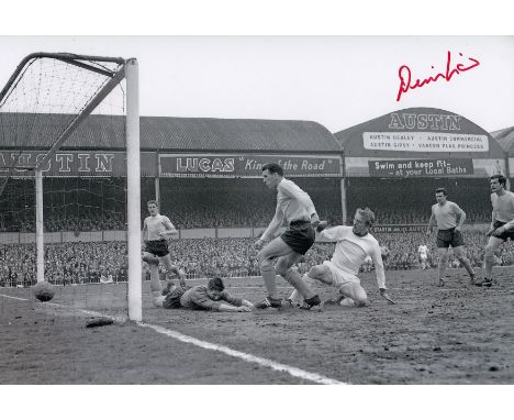 Autographed DENIS LAW 12 x 8 Photo : B/W, depicting a superb image showing Manchester United centre-forward DENIS LAW sliding