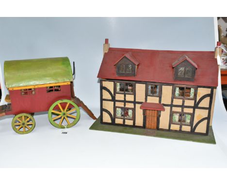 A SCRATCHBUILT SMALL SCALE WOODEN DOLLS HOUSE, c.1950s, modelled as a half-timbered house, front opens to reveal four rooms o