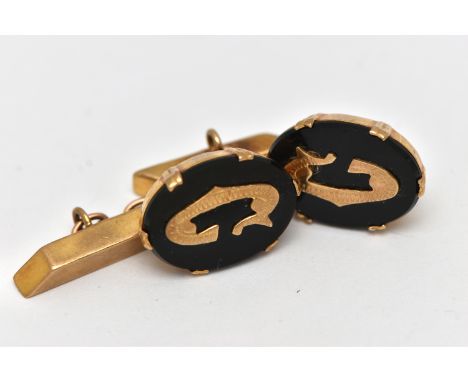 A PAIR OF 9CT GOLD AND ONYX CUFFLINKS, each designed with an oval onyx panel in a double six claw setting, each displaying th