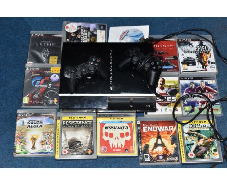 A PLAYSTATION 3 CONSOLE AND GAMES, games include Resistance Fall Of Man, Resistance 3, Gran Turismo 5, Uncharted Drake's Fort