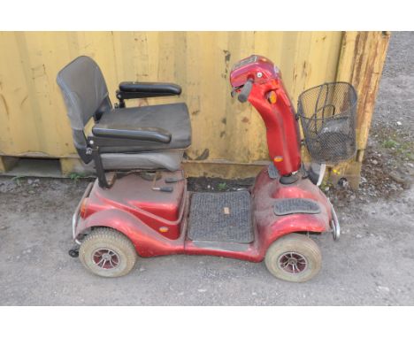 A DMA FOUR WHEELED MOBILITY SCOOTER(no key so untested) with power supply