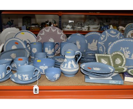 A LARGE COLLECTION OF WEDGWOOD BLUE JASPERWARE, comprising a large sugar bowl (scratches and black marks on exterior), four c