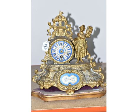 A DECORATIVE FRENCH GILT SPELTER MANTEL CLOCK with hand painted porcelain decorative plaques, with a beaded bezel, decorative