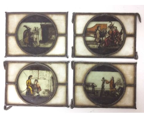 Four 18th / 19th century stained glass panels, each with a circular reserve depicting figures representing an artist, a sculp