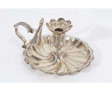 Victorian silver chamber stick of circular form, with raised spiral decoration and engraved foliate border, octagonal candle 