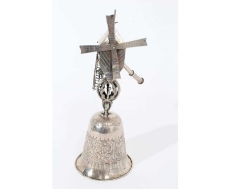 Late 19th century Dutch silver Windmill Wager Cup, the bell form cup with scroll and shell decoration, surmounted by a figure