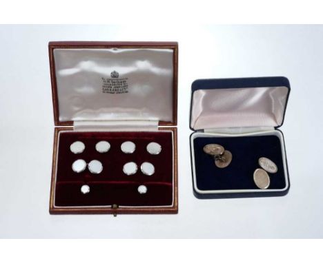 Set of 1950s gentlemen's Garrard &amp; Co. 9ct white gold cufflinks and dress studs with circular engine turned mother of pea