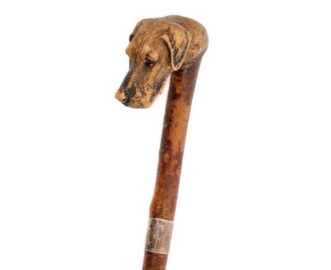 Well carved Swaine-Brigg novelty walking stick, the terminal carved with the head of a hound, with silver collar assayed for 