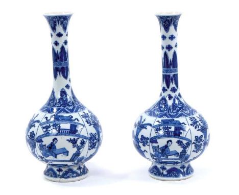 Pair of Chinese blue and white porcelain bottle vases, Kangxi style but 19th/20th century, decorated with panels of figures a