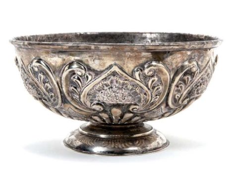 Late Victorian silver bowl of circular form, with raised scroll and floral decoration, on a domed circular base (London 1898)