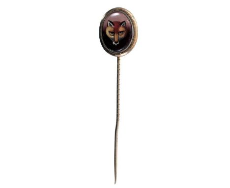 Five antique stick pins to include a cabochon garnet oroborous snake brooch, two Victorian garnet stick pins, 19th century mi