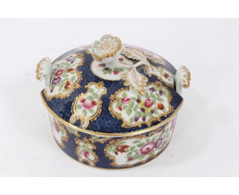 Worcester butter tub and cover, c.1770, polychrome decorated with flowers within gilt scrollwork cartouches, on a blue scale 