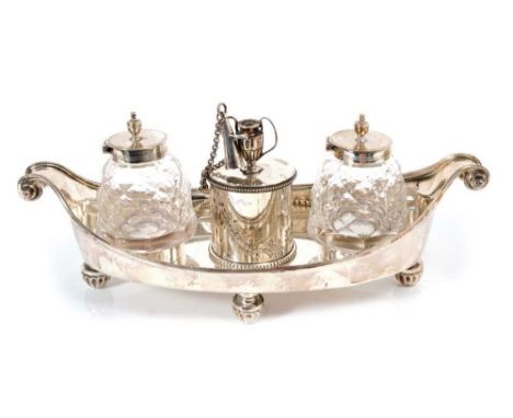 Victorian silver ink stand of boat shaped form, with bead border and scroll ends, on four fluted feet, together with a pair o