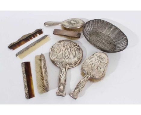 Selection of early 20th century silver mounted dressing table items, including a face mirror and two matching brushes, two ot