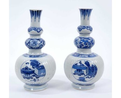 Pair of 18th/19th century Chinese blue and white triple gourd vases, the main sections ribbed, painted with panels containing